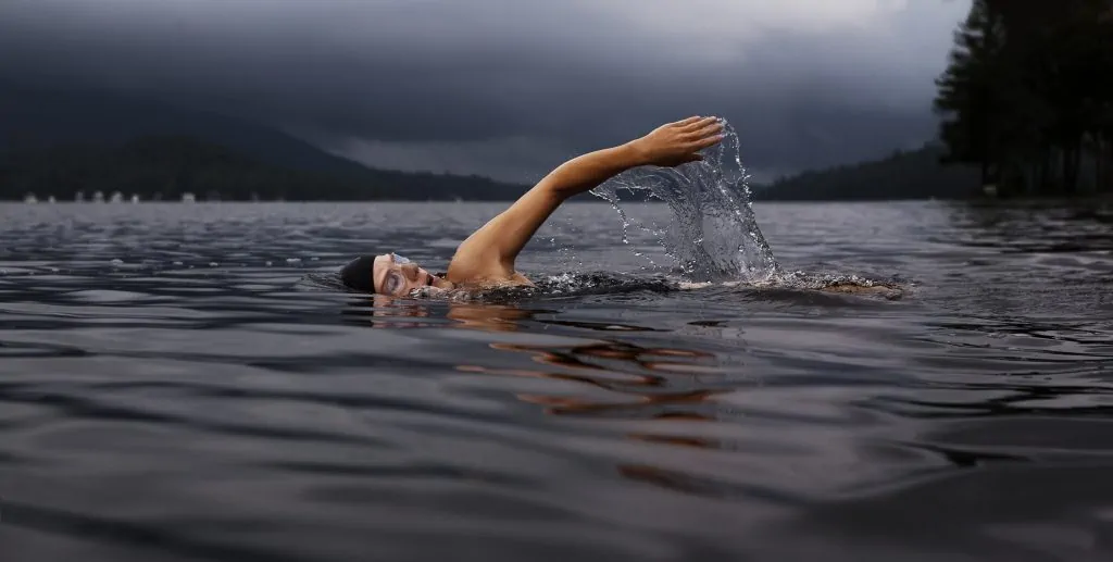 Individual swimming in a lake