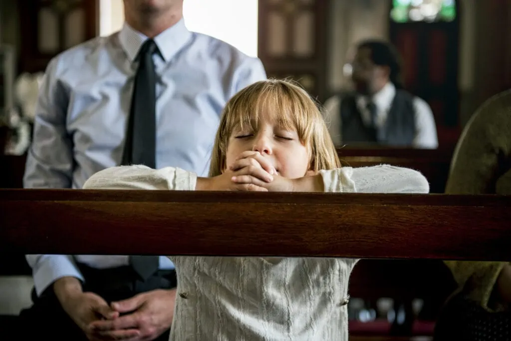 Girl praying at sensory friendly church.