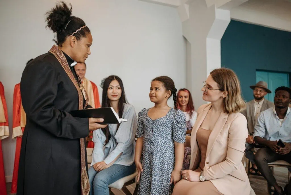 Black female pastor and a congregation in church