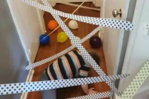 Child engaging in a sensory friendly obstacle course indoors.