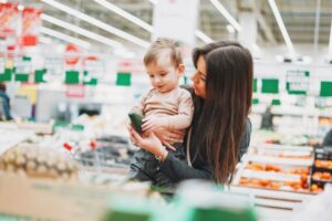 Mother and son grocery shopping.