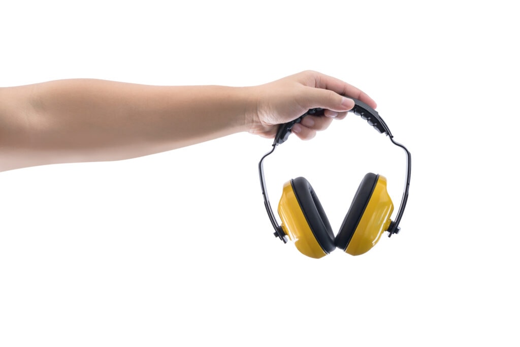 Hands holds working protective headphones is Isolated on a white background
