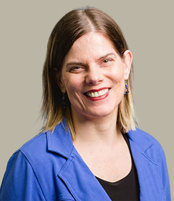 headshot of Christel Seeberger with grey background