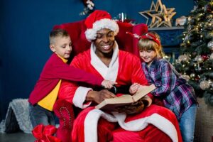 Santa claus reading a story to two children