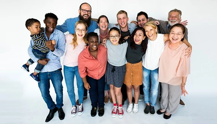 Diverse group of people in age and enthnicity in a group hug