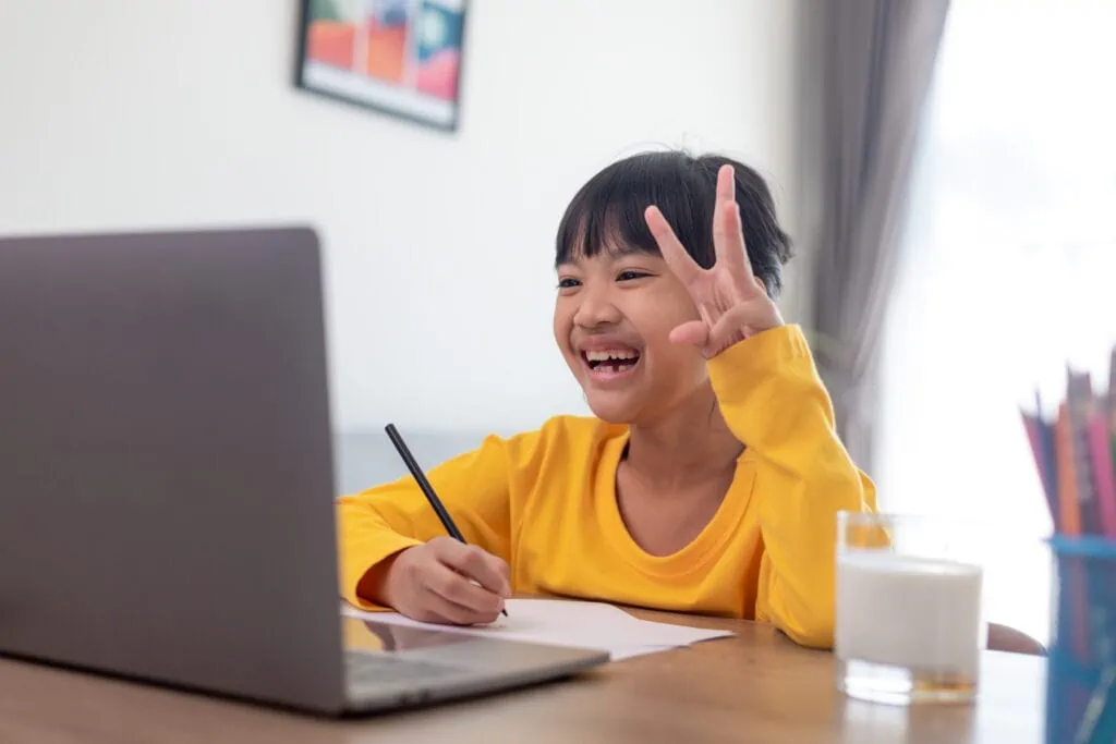 Young Asian child learning online