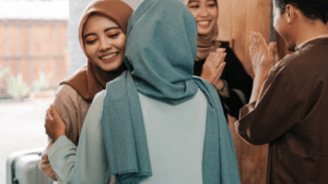 Muslim women greeting each other for a sensory-friendly Eid