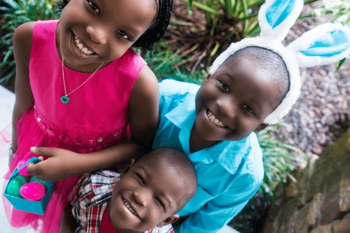 3 young children dressed up for Easter.