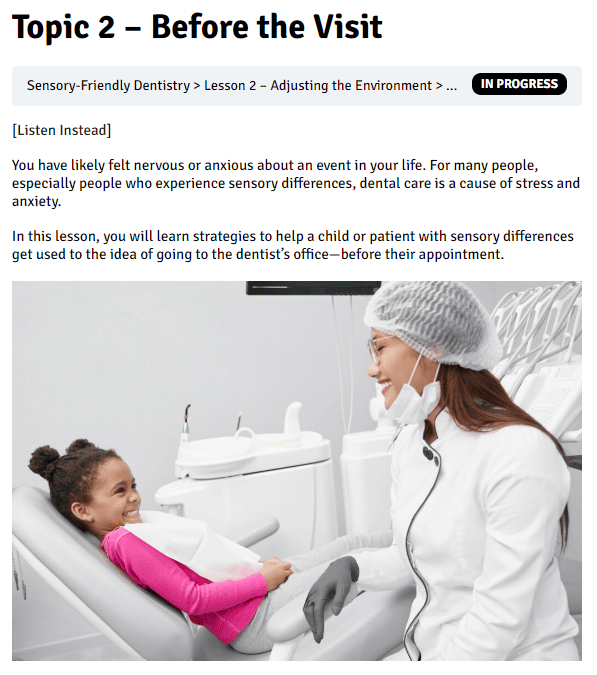 Woman dentist smiles at african american child in a dentist chair