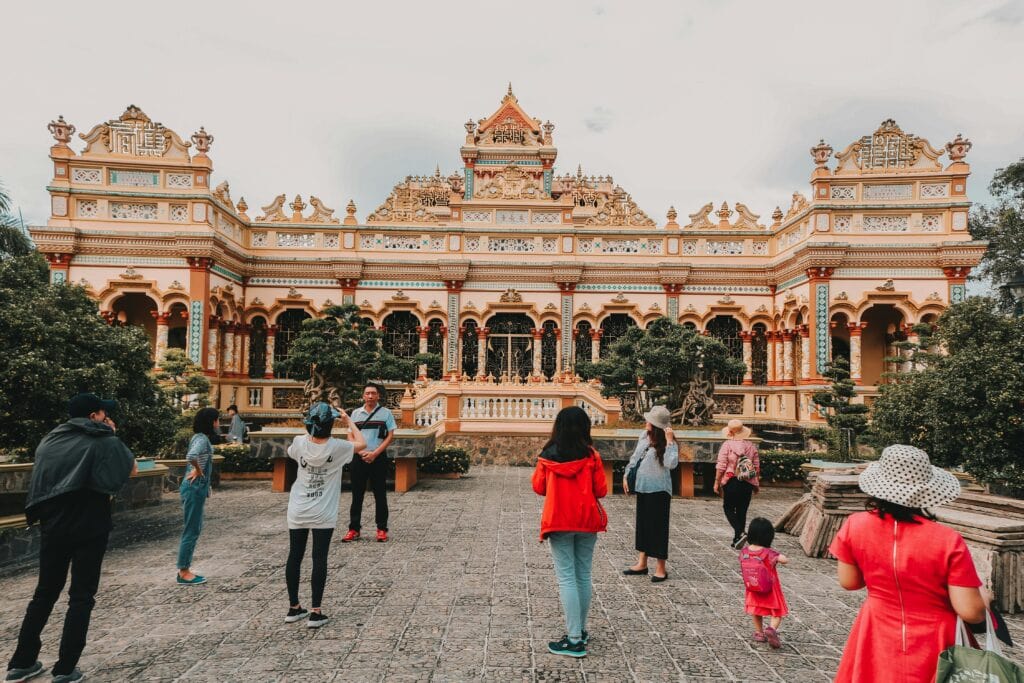 group of people in a courtyard outside a museum in Asia