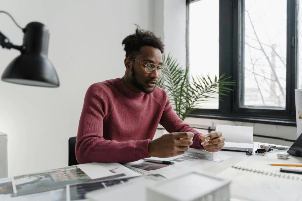Black man sitting at an office desk