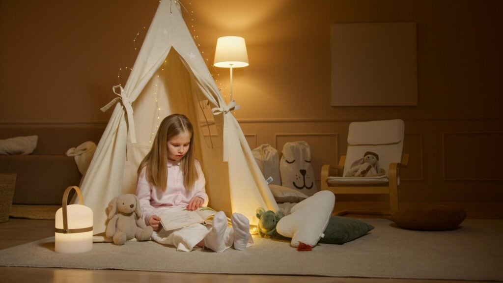 young girl in a tent inside her bedroom
